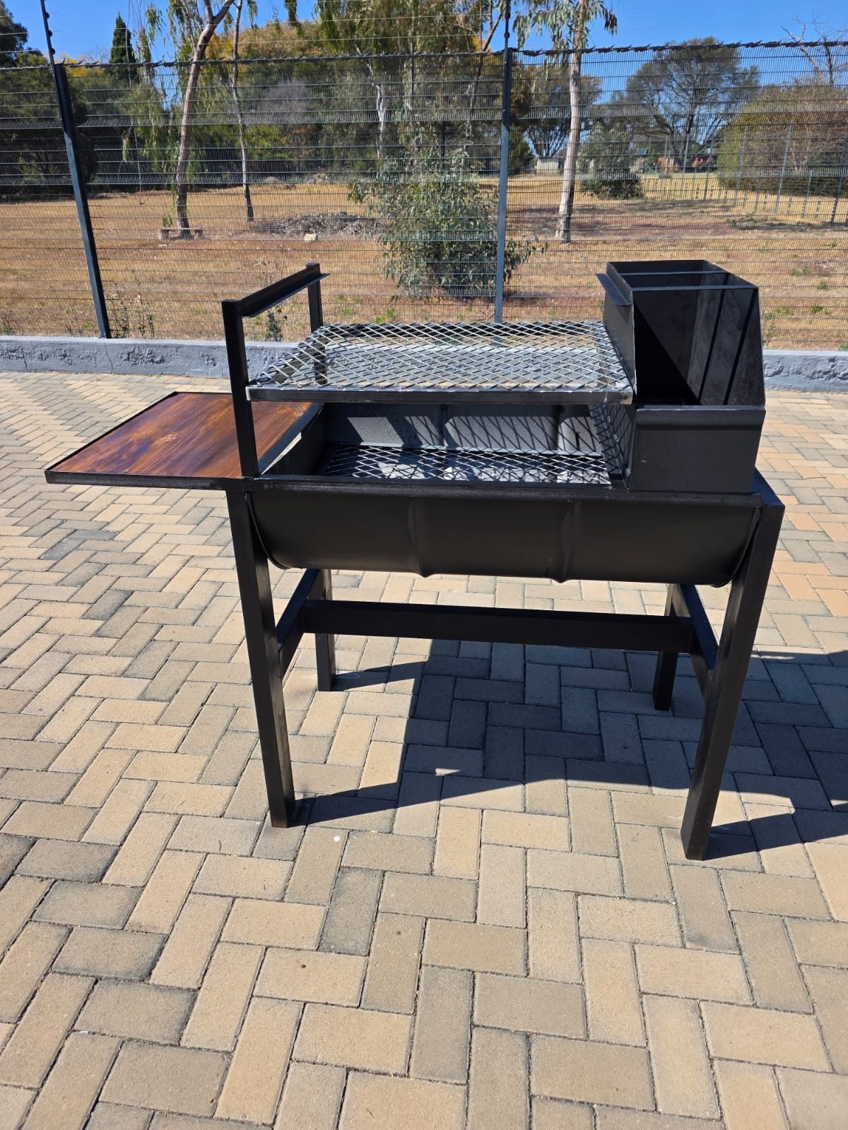 A custom steel braai with a folding side table