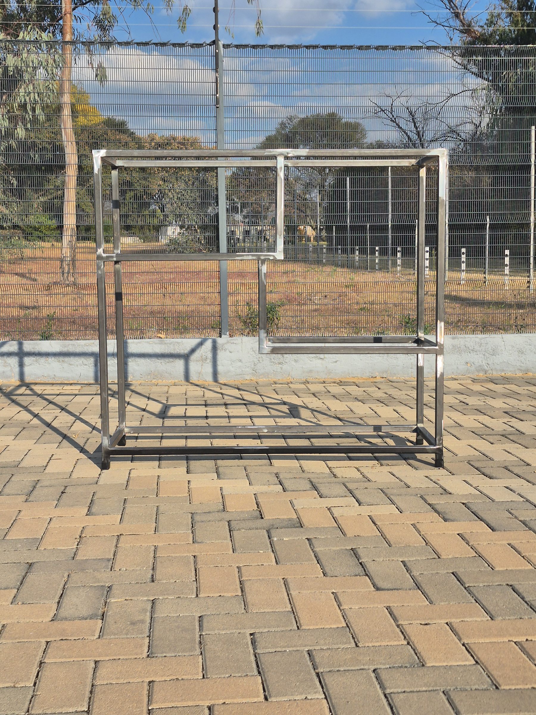 A raw steel table frame